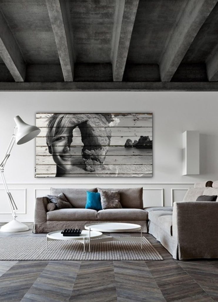 Neutral-toned living room with grey sectional sofa, white floor lamp, and abstract wall art