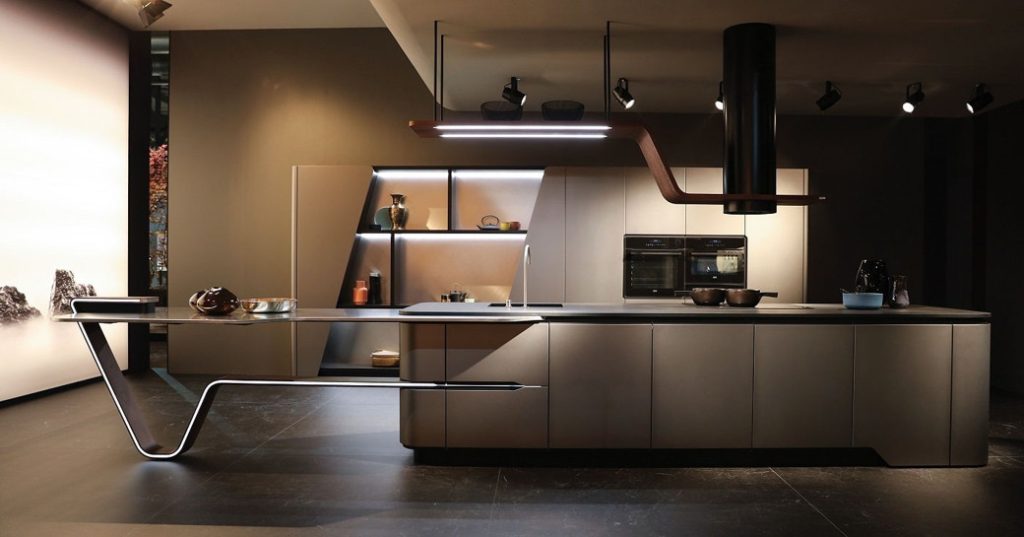 Sleek modern kitchen with integrated island and suspended lighting