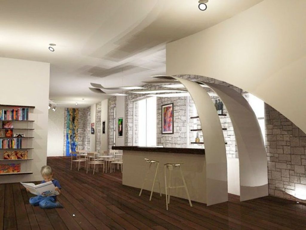 Modern kitchen bar area with curved white ceiling features and two stools