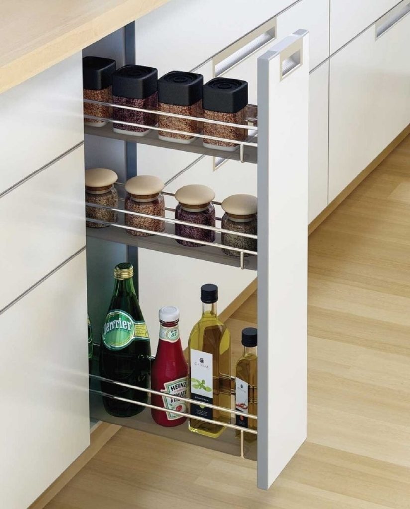 Pull-out kitchen cabinet organiser with spice jars and bottles