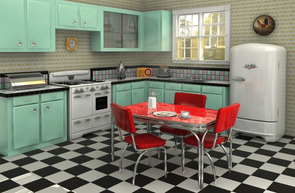 Kitchen with mint green cabinetry, black and white checkered floor, red dining chairs and table
