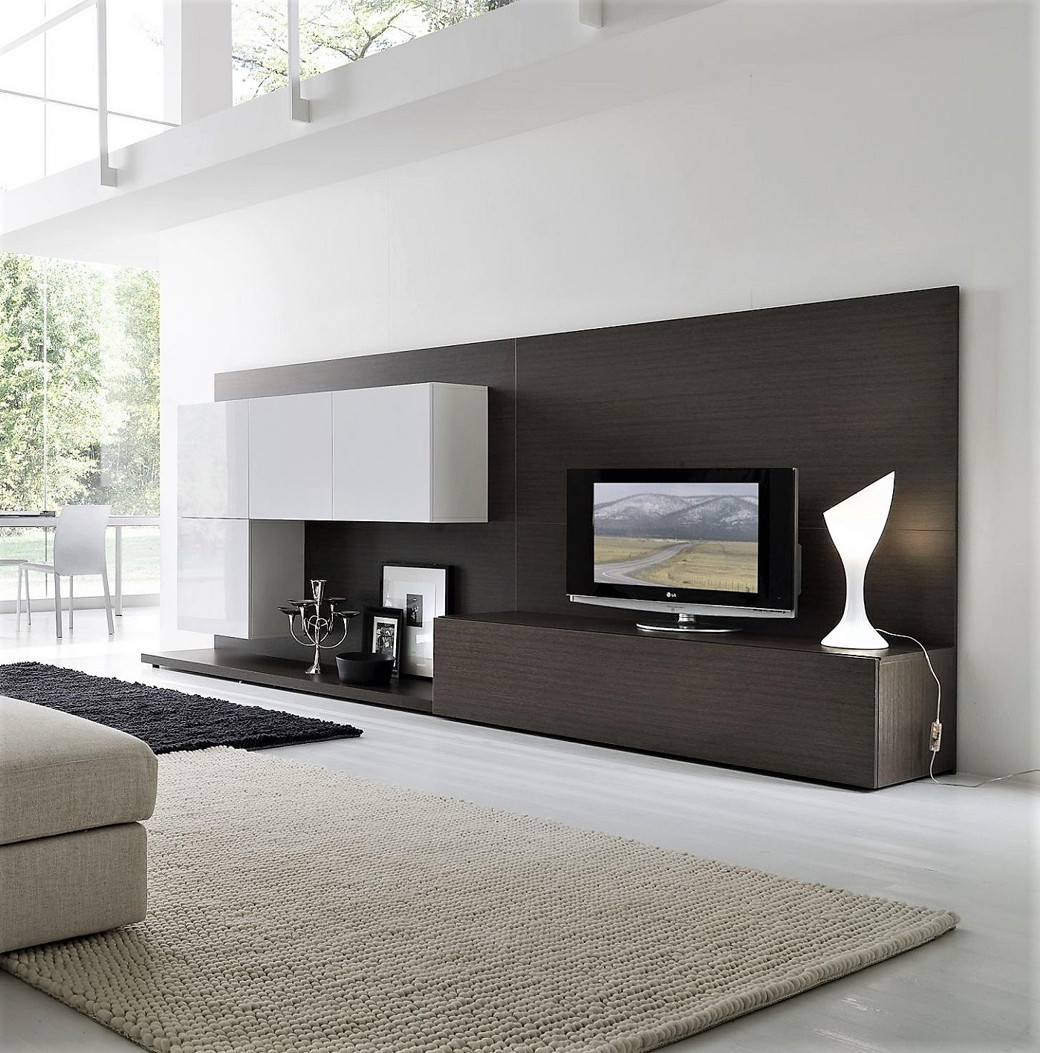 Modern TV cabinet with white wall-mounted storage, dark wood panel and base, small TV, and white sculptural lamp.