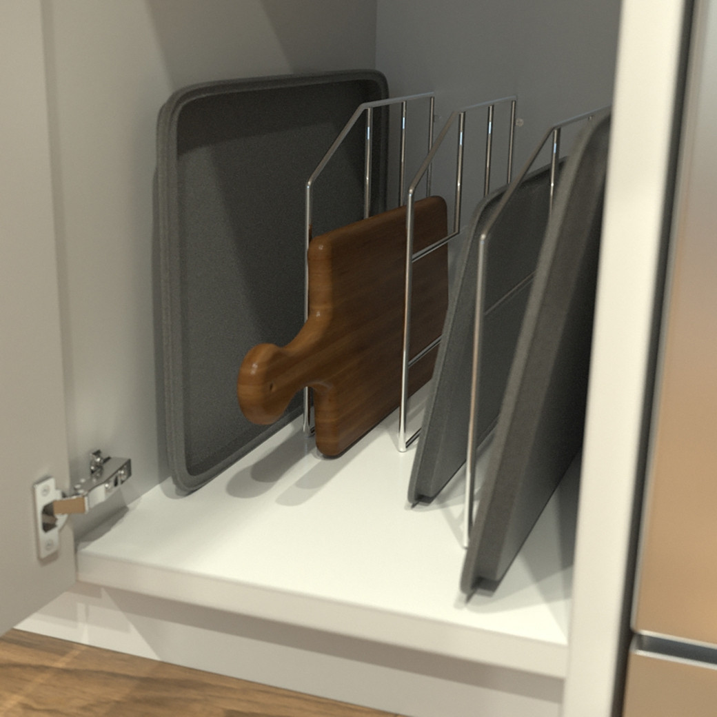 Kitchen cabinet with vertical metal racks holding baking trays and a wooden cutting board upright.