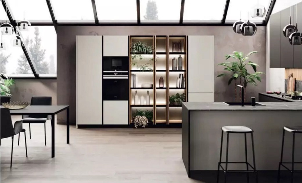 Modern kitchen with large windows, island with bar stools, dining table, built-in cabinets, and decorative plants.