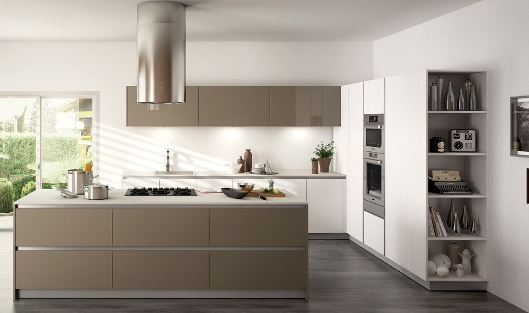 Modern kitchen with taupe and white cabinets, stainless steel range hood, built-in ovens, and open shelving with decor items.